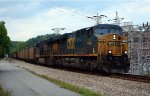 CSXT 743 with a train of SCWX coal hoppers in tow